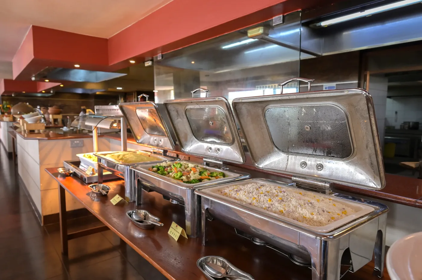 A buffet spread at Ole Sereni, rice and vegetable dishes